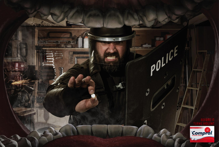 Compral 頭疼藥平面廣告創(chuàng)意設(shè)計(jì)“大嘴吃藥篇暴力性頭痛”-上海藥品平面廣告策劃設(shè)計(jì)公司