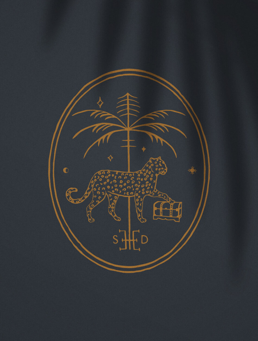 Trove 家具品牌logo設計。由豹+棕櫚樹+鑰匙組合而成